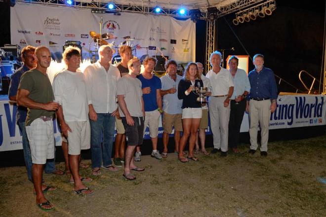 Mike Slade and crew of ICAP Leopard collect the Line Honours Trophy for the Yachting World Round Antigua Race © Ted Martin
